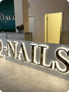 nails backlit sign